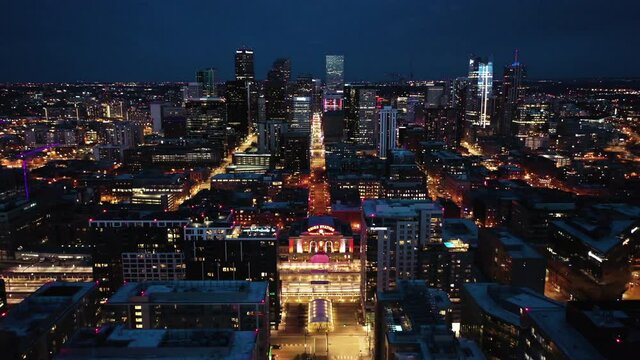 Downtown Denver Colorado, USA at Night. Aerial View of Lights on Union Station, Buildings and Streets. Cityscape Skyline, Drone Shot