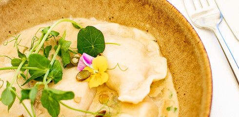 Traditional cuisine, culinary and gourmet travel, homemade dumplings in mushroom sauce recipe, polish pierogi in luxury restaurant in Old Town.
