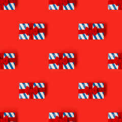 Pattern, Blue white stripe gift box, red bows on red background in national colors of USA, Russia, France or England, concept of Independence Day, national holiday, sale, Christmas theme, black friday