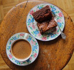 Top view of a cup of coffee and freshly baked brownies