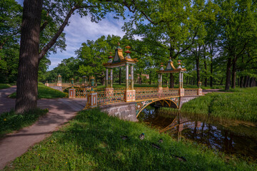 View of the Small Chinese Bridge in the Alexander Park of Tsarskoye Selo on a sunny summer evening,...