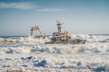 Waves crashing on the Zeila Shipwreck near Henties Bay on the Skeleton Coast in Namibia, southwest...