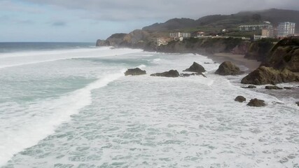 Aerial drone view of the beach of Bakio in the Basque Country in a foggy day