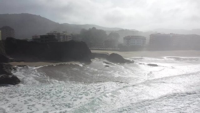 Aerial drone view of the beach of Bakio in the Basque Country in a foggy day