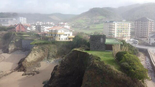 Aerial drone view of the beach of Bakio in the Basque Country in a foggy day