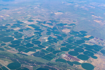 Aircraft view agriculture circled fields in the desert near Denver, Colorado, US
