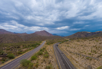 Aerial view highway across the arid desert Arizona mountains adventure traveling desert road