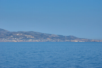 Parikia, Greece - June 2017: Port and the town Parikia as seen from a ferry during the loading of the ship, Paros island in Greece, Europe