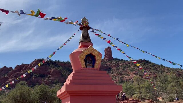 Prayer flags extend from the top of the Amitabha Stupa, Sedona, Arizona to the ground.