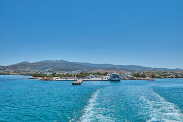 Fototapeta premium Antiparos island, Greece - June 2017: Beautiful seascape view travelling to Antiparos island as the boat approaches the port. Panoramic summer scenery in Greece at Antiparos island, Cyclades, Greece