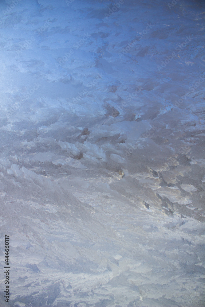 Aufkleber Textured frost patterns on the glass. Ice crystals on the window on a cold, frosty day in winter.