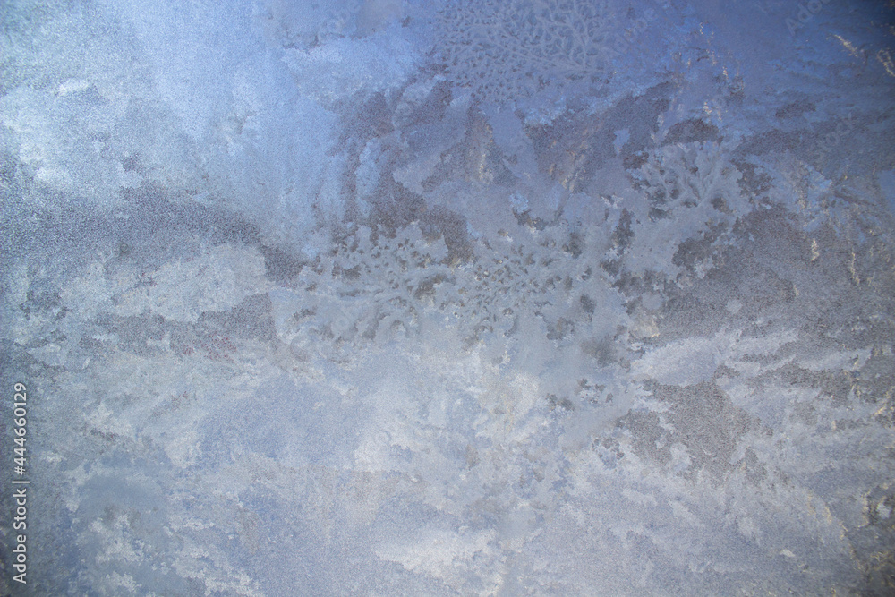 Aufkleber Textured frost patterns on the glass. Ice crystals on the window on a cold, frosty day in winter.