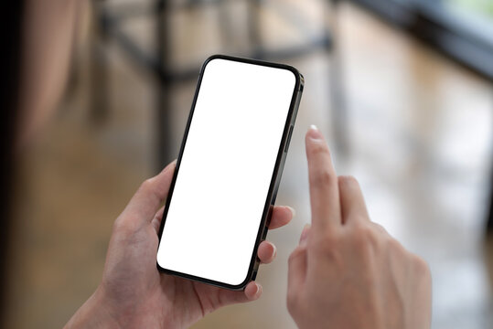 Image of woman using a smartphone blank white screen at the office.