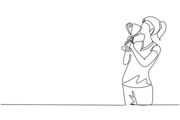 Continuous one line drawing female athlete wearing jersey kissing trophy after winning world sports competition. Proud and unforgettable moment of victory. Single line draw design vector graphic