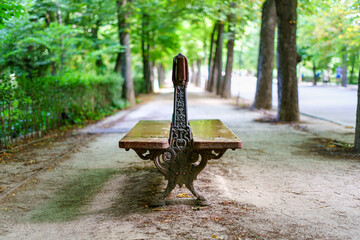 Old wooden bench to sit and rest in a park.
