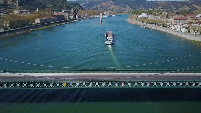 Aerial view of a freight river transport ferry - peniche - on the Rhone River, Tain l'Hermitage