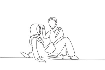 Obraz na płótnie Canvas Single continuous line drawing romantic Arabian couple having picnic in park. Relaxing together sitting on the ground and men feeding grapes to women. One line draw graphic design vector illustration