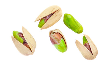 Pistachios isolated on white background, top view.  Pistachios nuts Flat lay. Creative layout.