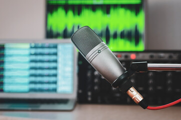 Professional microphone and wave form on screen