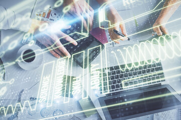 Double exposure of man and woman working together and education theme hologram drawing. Computer background. Top View.