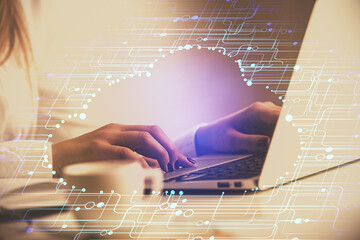 Multi exposure of woman hands working on computer and data theme hologram drawing. Tech concept.