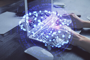 Multi exposure of woman hands working on computer and brain hologram drawing. Ai concept.