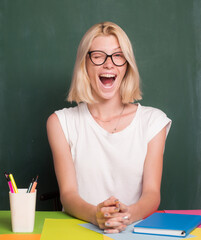 Happy funny teacher winking. Portrait of young caucasian female teacher or student. Cheerful...