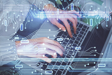 Double exposure of woman hands working on computer and data theme hologram drawing. Tech concept.
