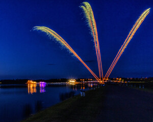 Fototapeta na wymiar Three summer fireworks in the blue sky