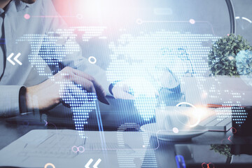 Multi exposure of man's hands holding and using a digital device and map drawing. International business concept.