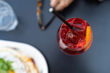 Overhead view of aperol spritz cocktail on dinner table