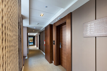Fototapeta na wymiar Interior of a carpeted hotel corridor doorway