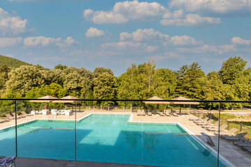 View to a outdoor swimming pool in a modern hotel