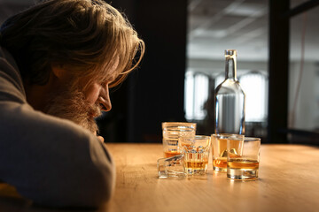 Drunk senior man late in evening at home