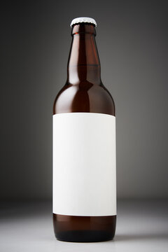 Beer bottle mockup. Full bottle of lager beer with blank labels on dark background