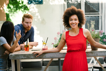 Young friends having a great time together. Group of people talking and smiling.