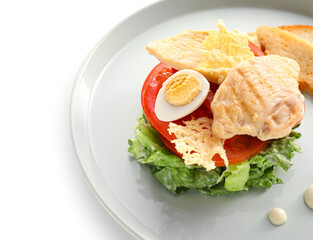 Plate with Caesar salad on white background, closeup