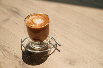 a cup of coffee with a pattern of heart. beautiful serving of hot drinks.
