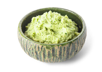 Bowl with tasty guacamole on white background