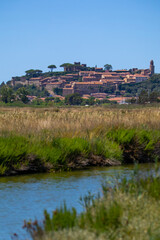 Obraz premium view of the Italian city, Castiglione della Pescaia from afar