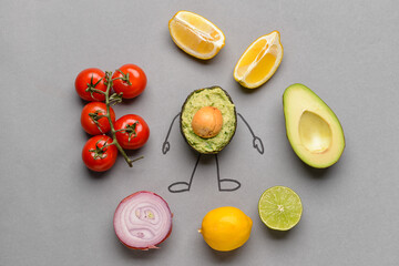 Creative composition with tasty guacamole and ingredients on grey background