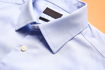 Stylish male shirt on color background, closeup