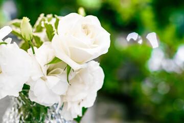 Wedding decoration, table decor and floral beauty, bouquet of white roses in luxury restaurant,...
