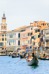Venice, Italy - May 25, 2019: view of grand canal full of boats and gandolas rialto bridge on background