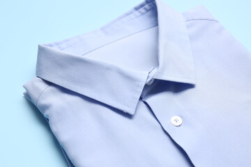 Stylish male shirt on color background, closeup