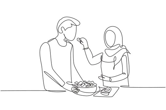 Single Continuous Line Drawing Beautiful Arab Wife Feeds Her Husband Food And In Front Of Him Is Bowl Filled With Salad. Cooking Together In Kitchen. One Line Draw Graphic Design Vector Illustration