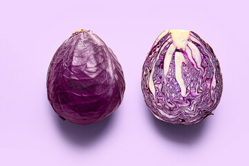 Half of fresh purple cabbage on color background