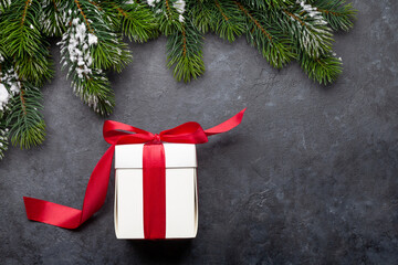 Christmas greeting card with fir tree and gift box