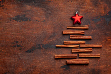 Christmas card with fir tree shaped cinnamon spice and star decor