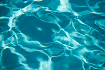 Obraz premium Water in swimming pool, background with high resolution. Wave abstract or rippled water texture.